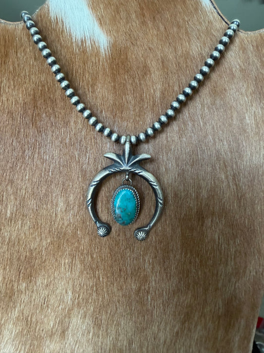 Native made turquoise naja pendant
