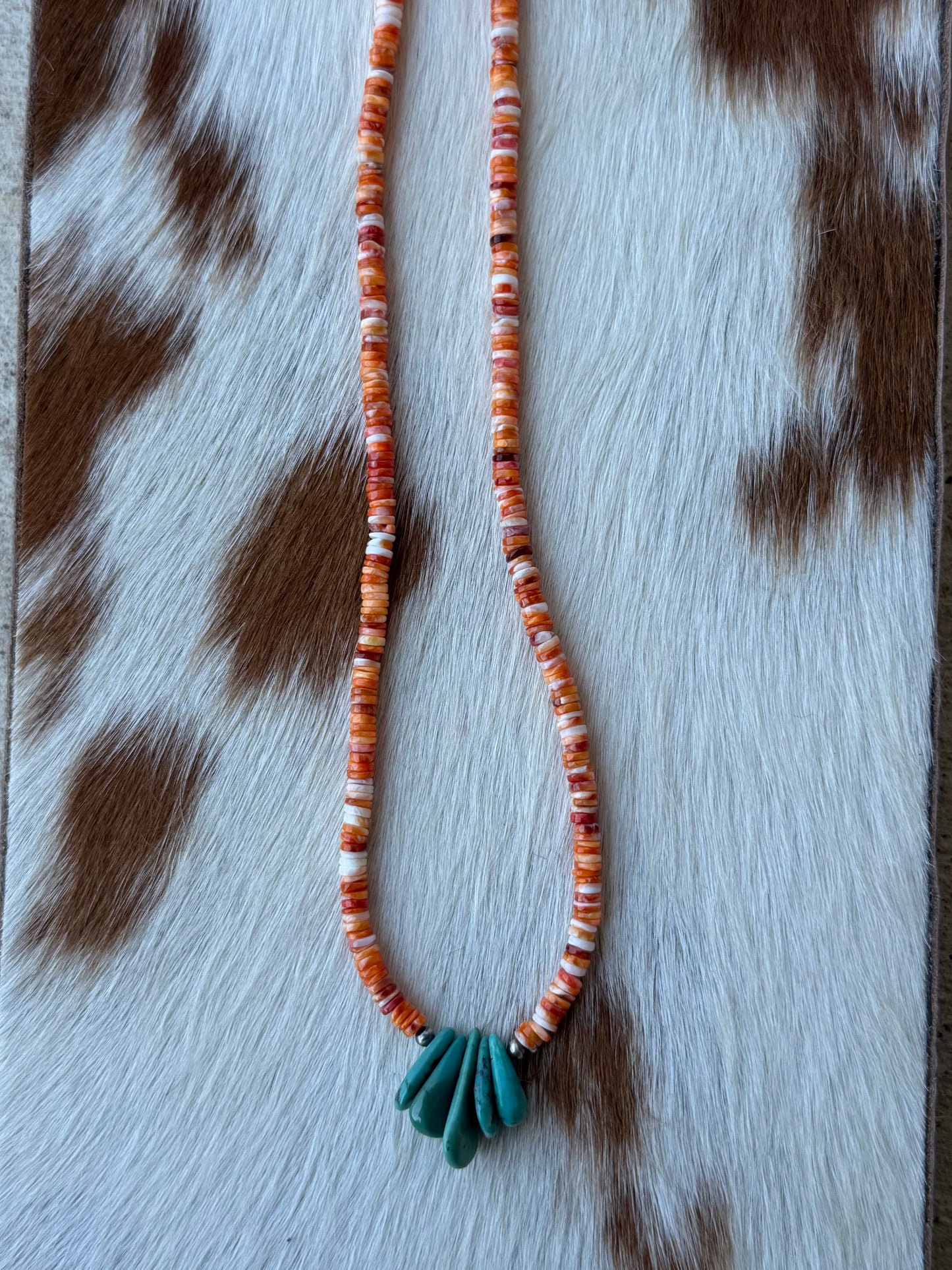 Turquoise and orange spiny stacker