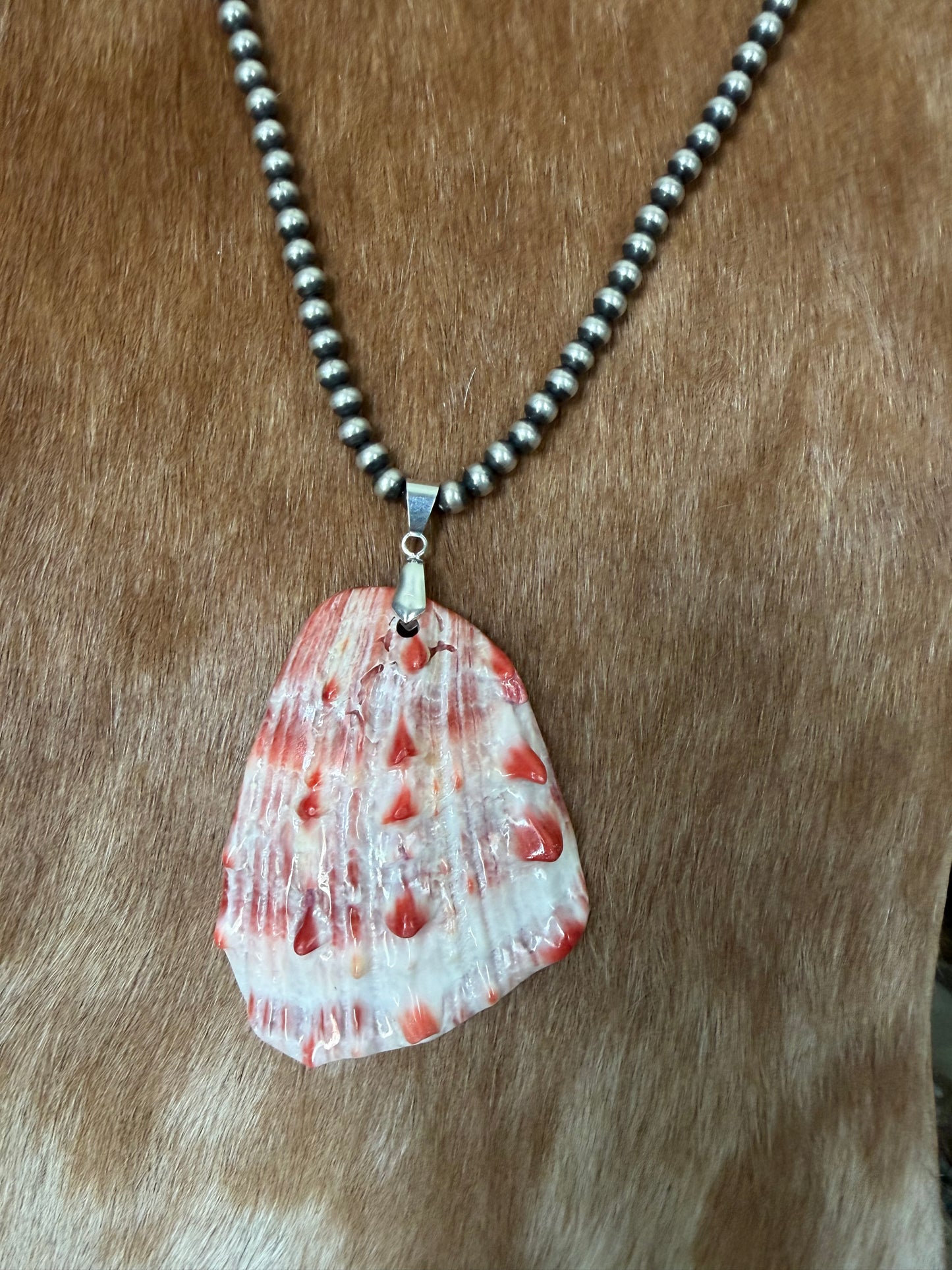 Orange spiny shell pendant