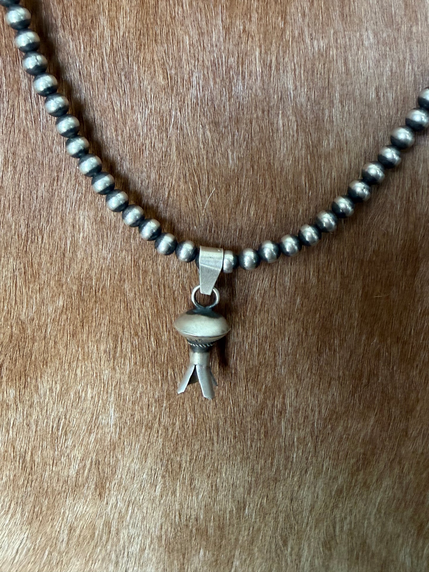 Native made blossom pendant