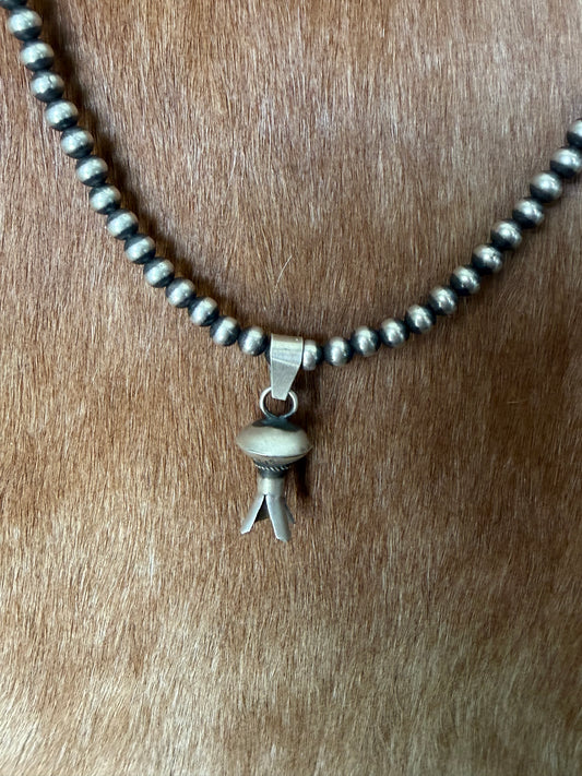 Native made blossom pendant