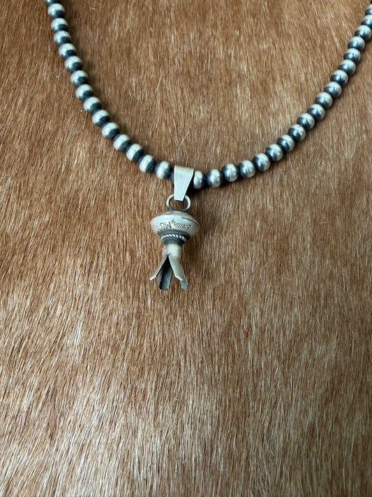 Native made blossom pendant