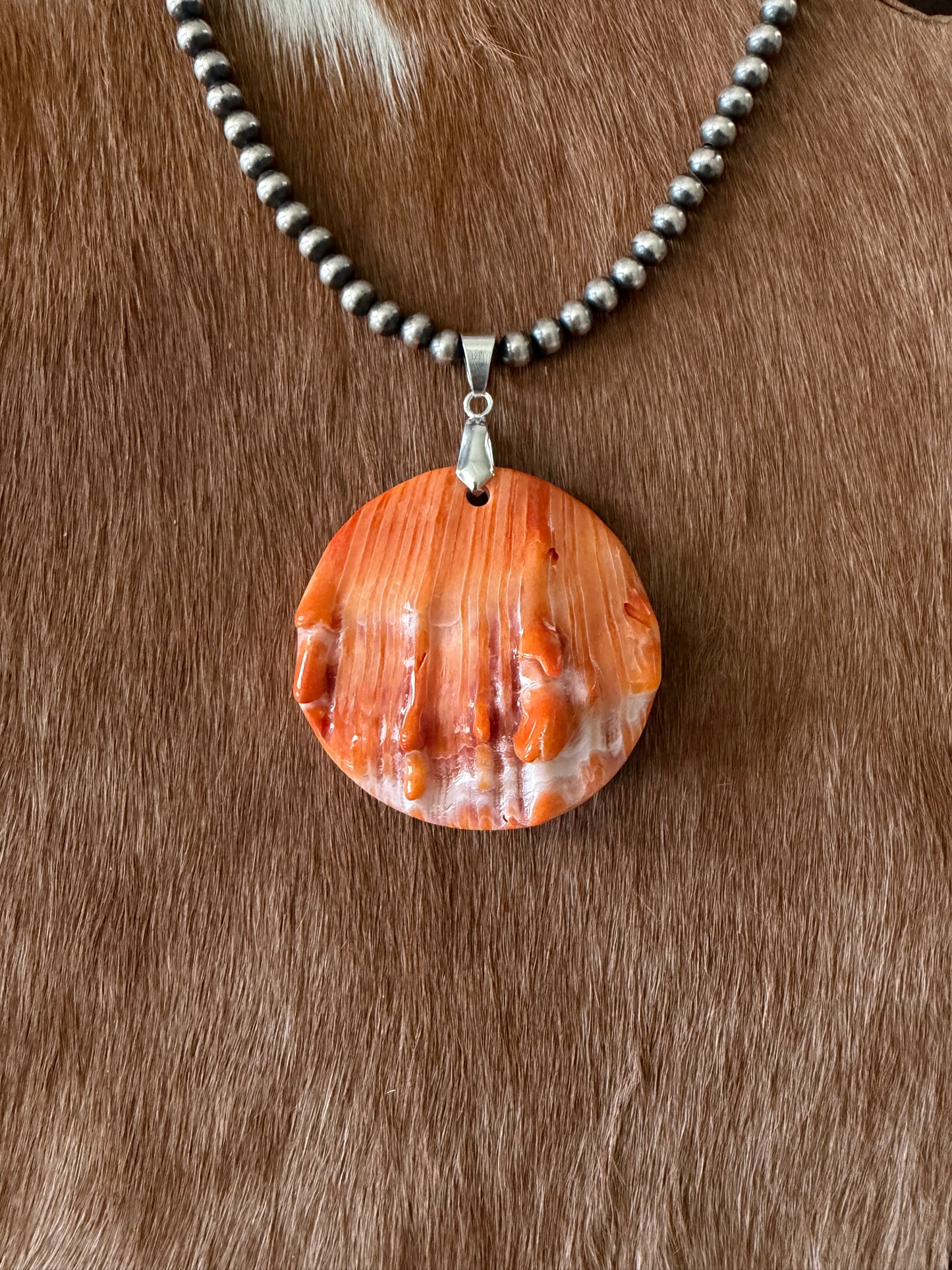 Orange spiny shell pendant